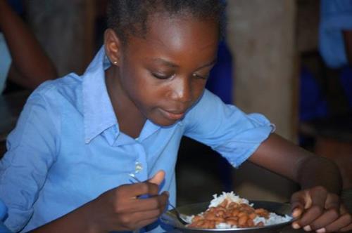 Image of a Girl Eating Rice