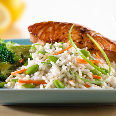 White rice on a plate with salmon and broccoli